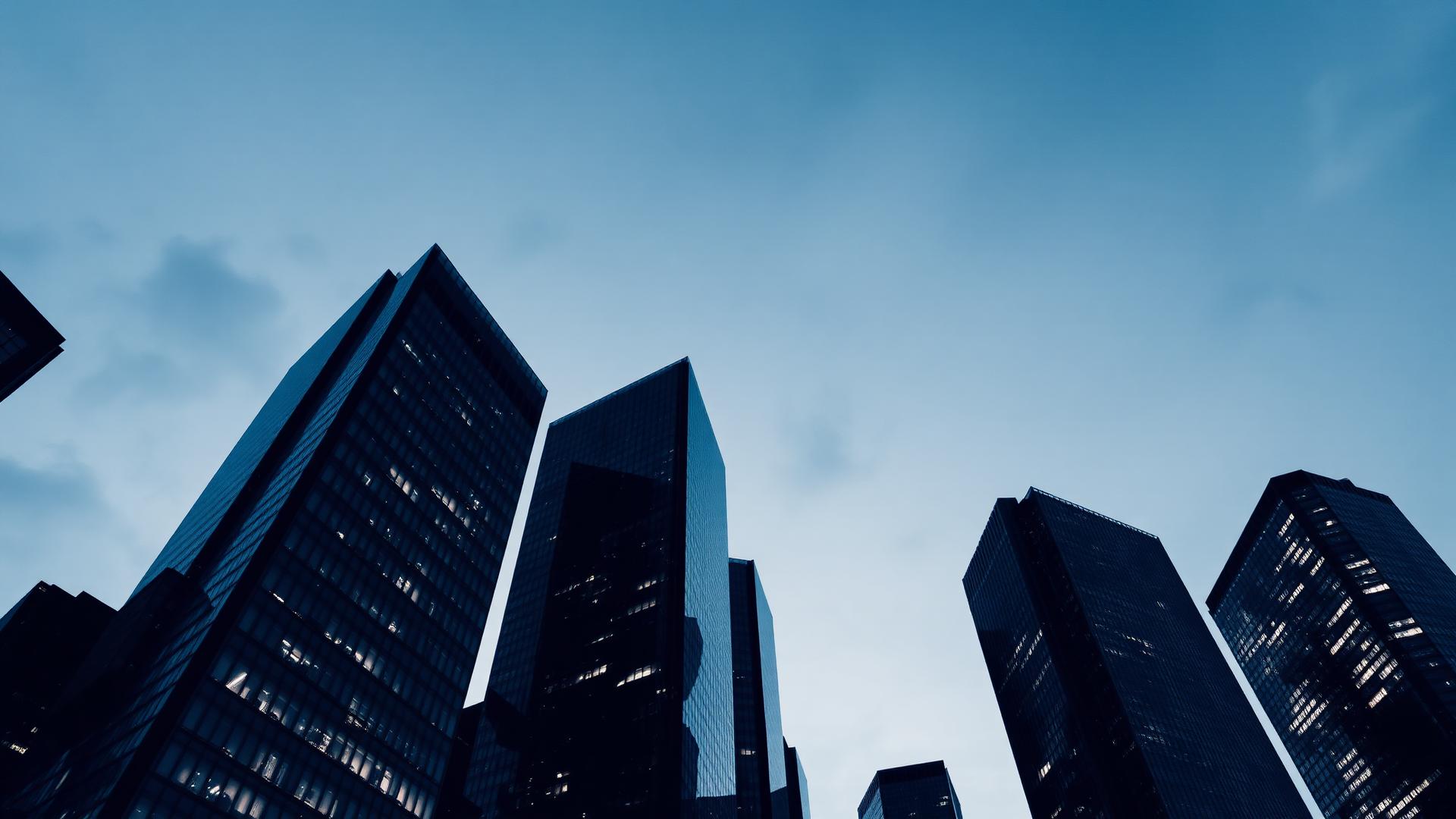 Glass office towers at dusk in a Texas central business district